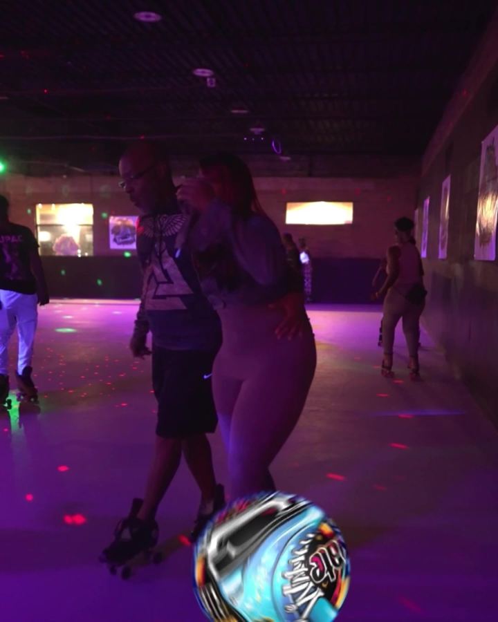 The rink floor under soft colored lights